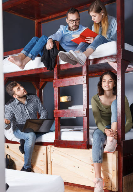 istock Portrait of young travelers communicating while resting in moder 1148044514