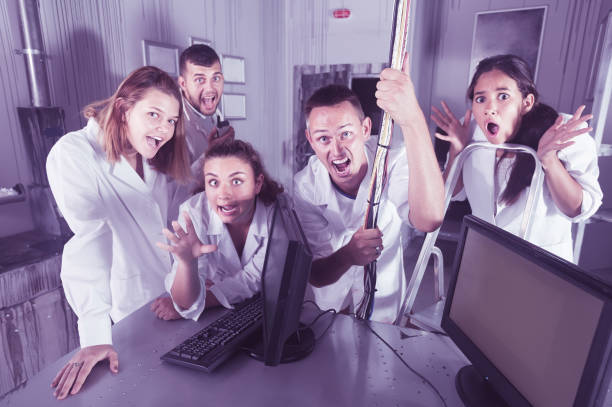 istock Group of young people having fun in escape room 1148044635