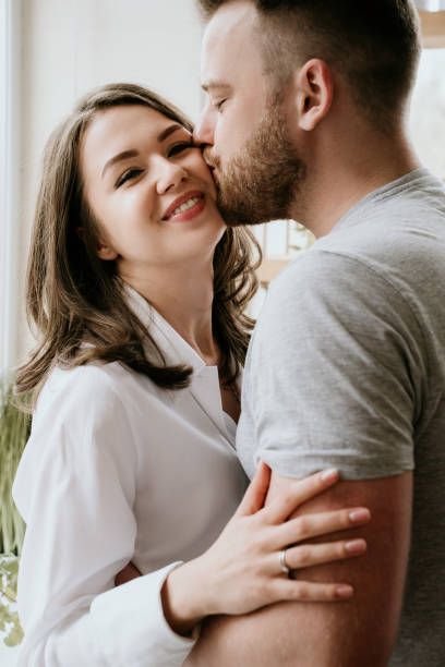 istock Romantic young couple cooking together in the kitchen,having a great time together 1148044773
