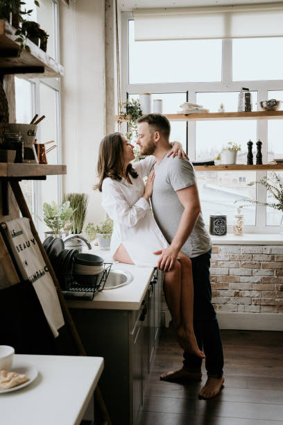 istock Romantic young couple cooking together in the kitchen,having a great time together 1148044829