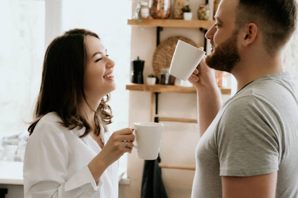 istock Romantic young couple cooking together in the kitchen,having a great time together 1148045036
