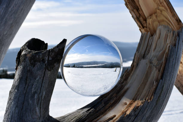 istock Winter mountain landscape in crystal ball. 1148045223