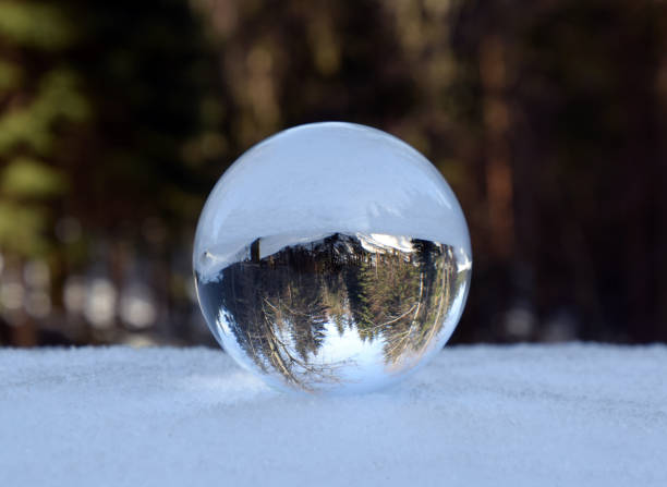 istock Winter mountain landscape in crystal ball. 1148045324