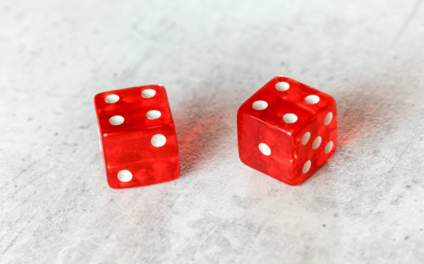 istock Two translucent red craps dices on white board showing Hard Eight from Decatur double number 8 1148046887