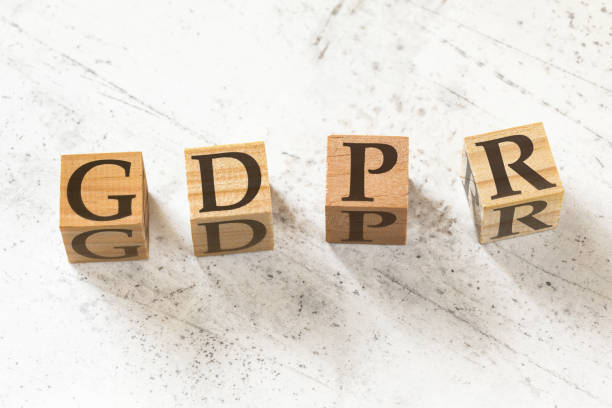 istock Four wooden cubes with letters GDPR meaning General Data Protection Regulation on white working board. 1148047477