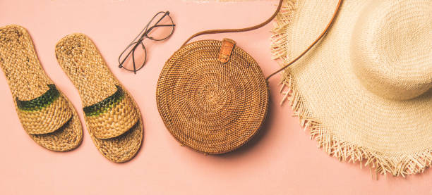 istock Variety of summer apparel items over pastel background, wide composition 1148047894