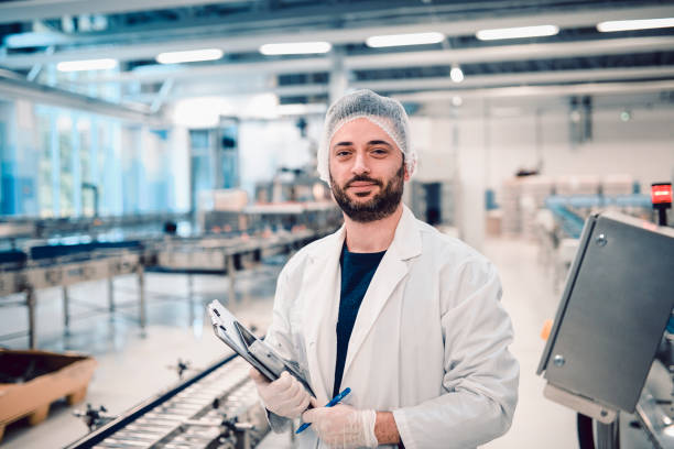 istock Happy Male Technician In Modern Bottling Plant 1148047906