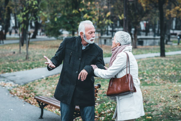 istock Mature Couple Having a Debate in the Public Park 1148048073