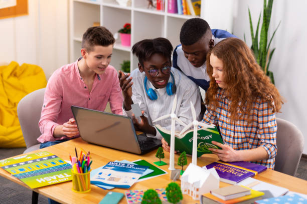 istock Four teenagers feeling busy while preparing ecology project together 1148048933