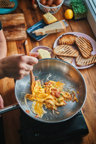 istock Preparing Egg Omelet with Salmon and Spring Onions For Breakfast 1148049154