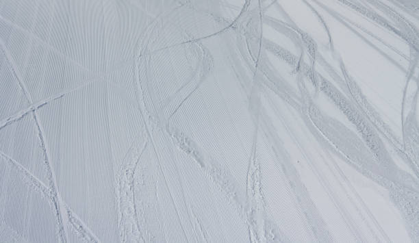 istock Sledge trace on winter mountain hill and snow covered landscape 1148051869