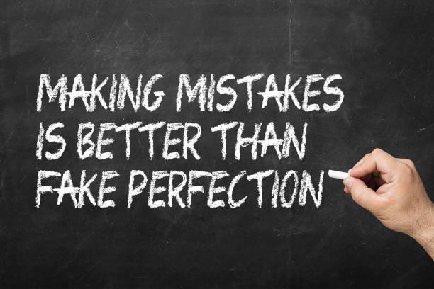 istock Making mistakes is better than fake perfection on the blackboard 1148053340