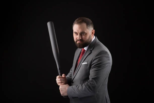bearded man in suit and red tie with baseball bat - home run baseball baseball bat businessman imagens e fotografias de stock