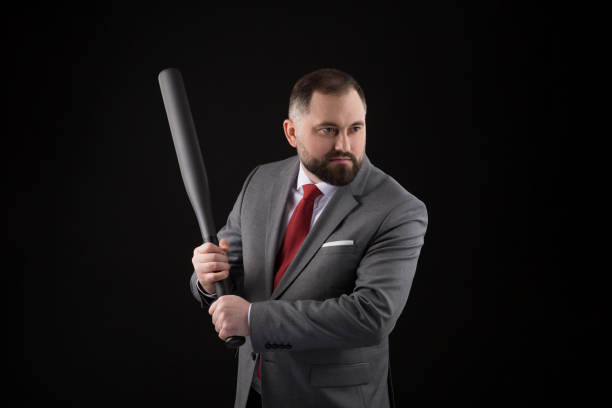 bearded man in suit and red tie with baseball bat - home run baseball baseball bat businessman imagens e fotografias de stock