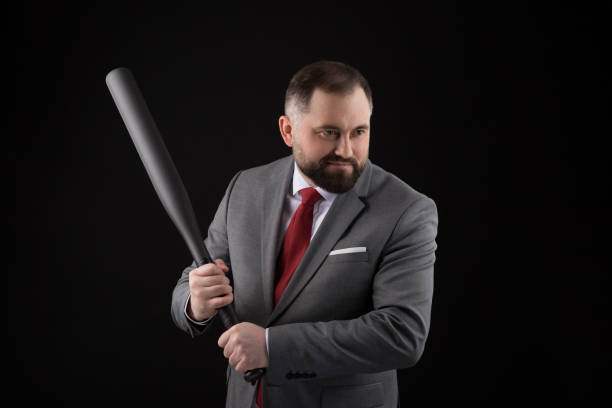 bearded man in suit and red tie with baseball bat - home run baseball baseball bat businessman imagens e fotografias de stock