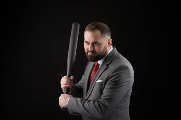 bearded man in suit and red tie with baseball bat - home run baseball baseball bat businessman imagens e fotografias de stock