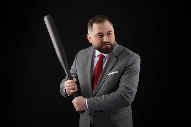 bearded man in suit and red tie with baseball bat - home run baseball baseball bat businessman imagens e fotografias de stock