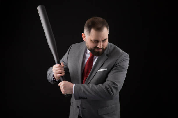 bearded man in suit and red tie with baseball bat - home run baseball baseball bat businessman imagens e fotografias de stock