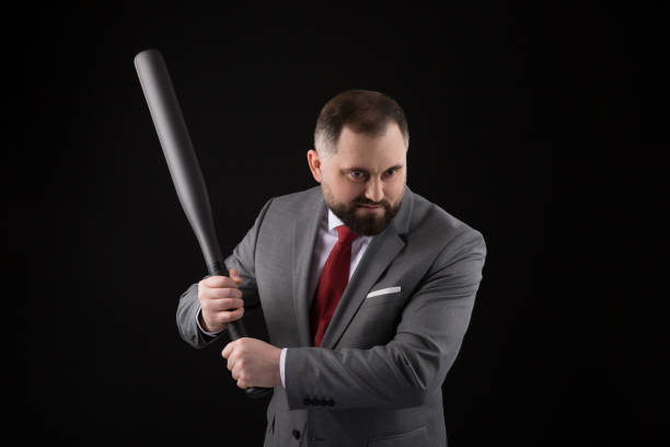 bearded man in suit and red tie with baseball bat - home run baseball baseball bat businessman imagens e fotografias de stock