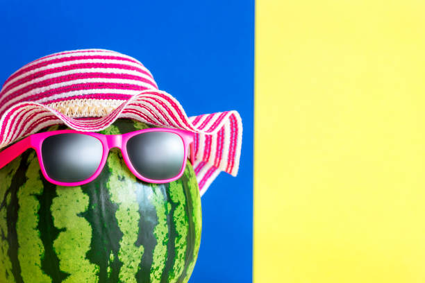 istock Cute watermelon with sunglasses and a hat 1148056369