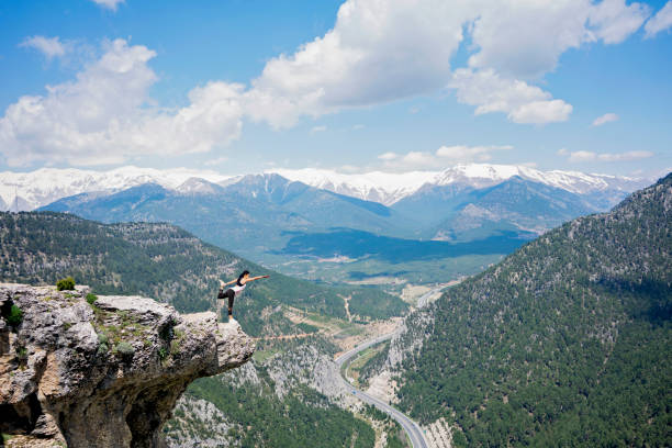 istock Stretching on top of mountain. 1148059522