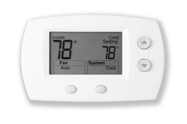White digital thermostat with lit display reads 78 degrees stock photo