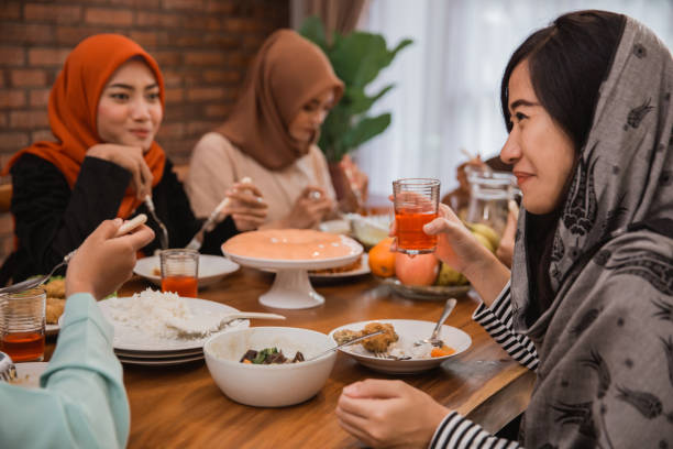 istock muslim people having dinner break fasting together 1148065046