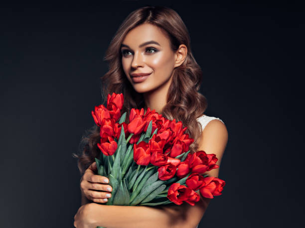 istock Beautiful woman with flowers 1148065745