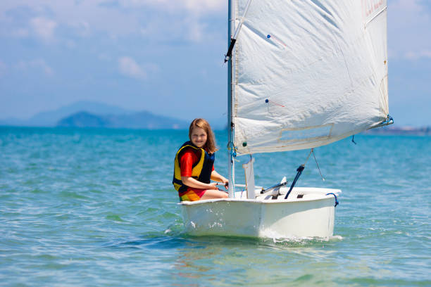 istock Child sailing. Kid learning to sail on sea yacht. 1148066103