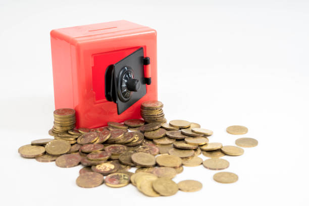 istock Red safe box spilled coins 1148066386