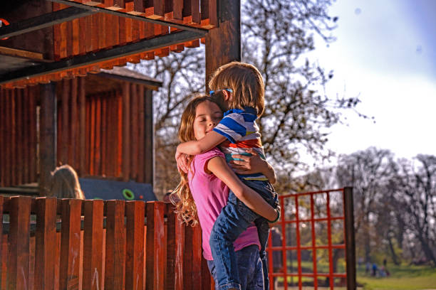 istock Sisters love at playground 1148067502