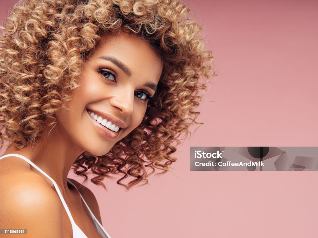 Beautiful Young Woman With Curly Hair Stock Photo - Download Image Now -  Beautiful People, Beauty Spa, Curly Hair - iStock