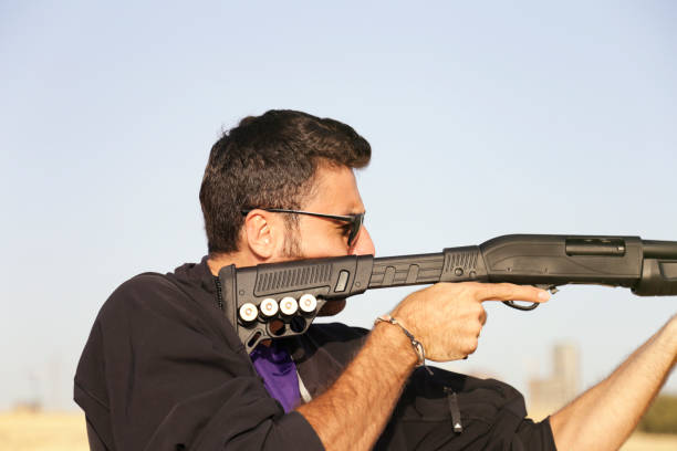 istock Man shooting on an outdoor shooting range 1148070491