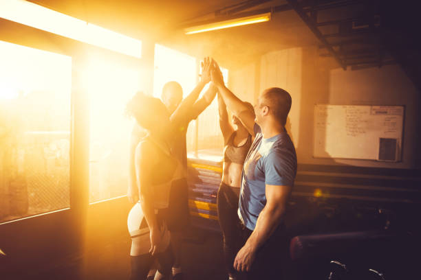 istock Athletes high fives after successful workout 1148070573