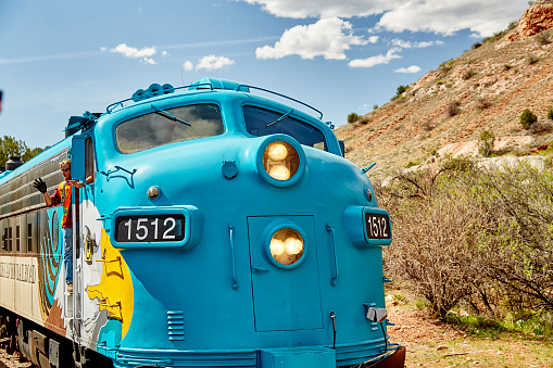 Clarkdale, Arizona, USA - May 4, 2019: Verde Canyon Railroad train engine and engineer driving on scenic route