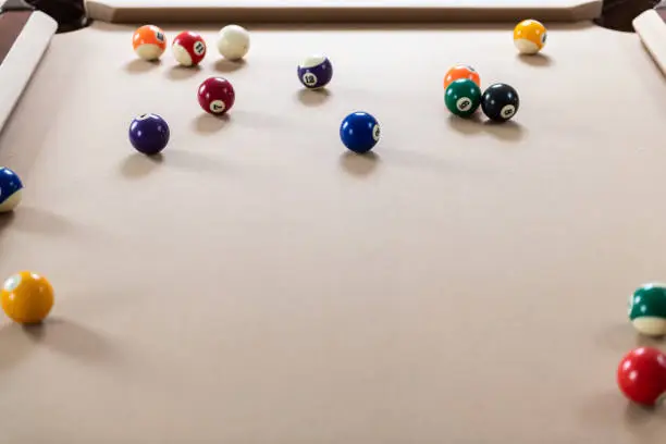 Pool table playing game of billiard with colorful white and color numbered balls
