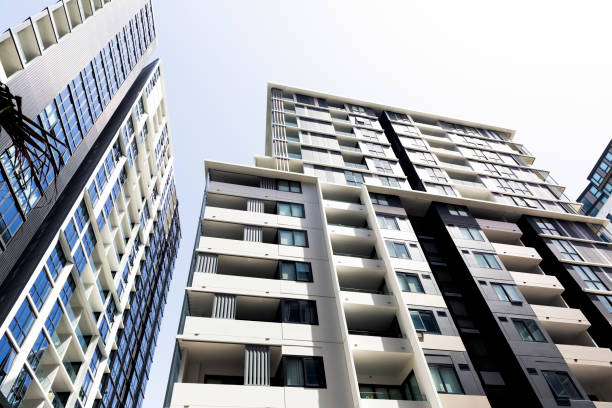 istock Low angle view of modern apartment buildings, sky background with copy space 1148083166