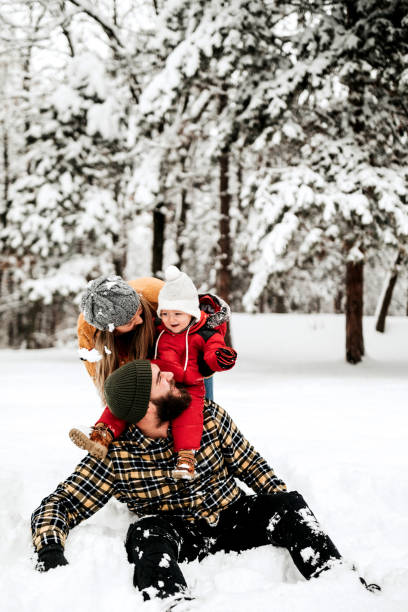 istock Let's cover up dad with snow 1148090241
