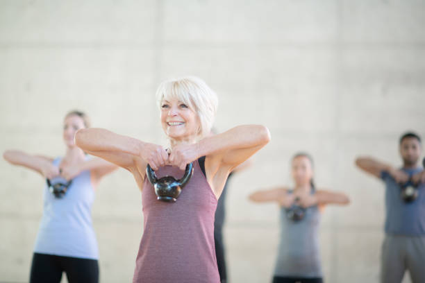 istock Senior woman with kettle bell 1148092044