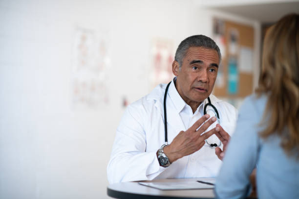 istock Male doctor talking to his patient 1148092290