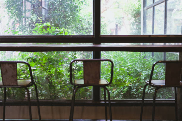 istock stool in cafe coffee shop near garden window 1148093097