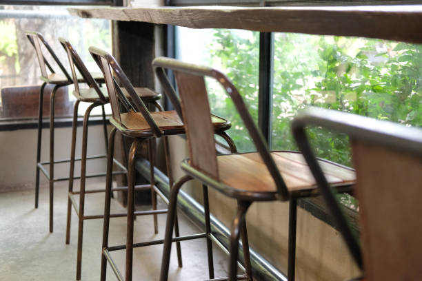 istock stool in cafe coffee shop near garden window 1148093120