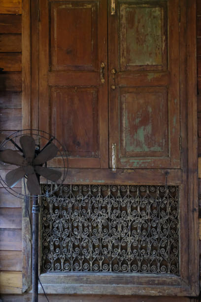 istock old vintage wooden window with curved steel frame 1148093128