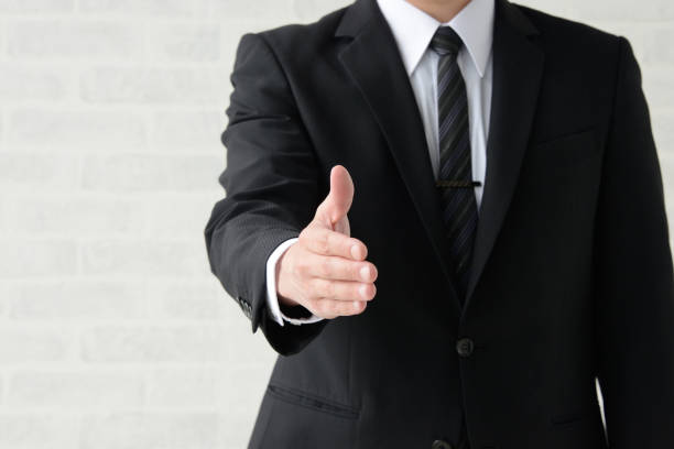 istock Business man giving hand 1148093513
