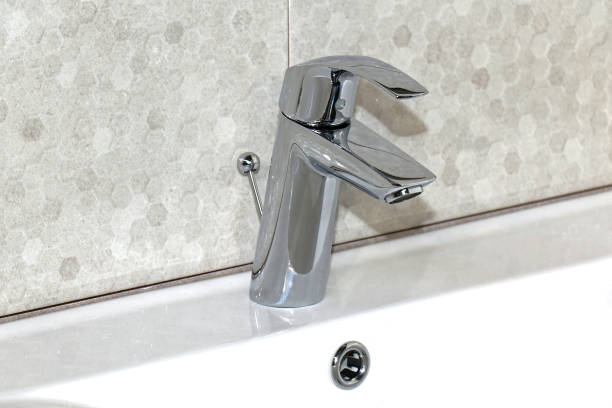 istock Silver faucet on retro washbasin 1148112162