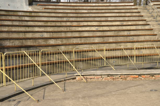 istock Amphitheater. Wooden benches set in stone circle. 1148120304