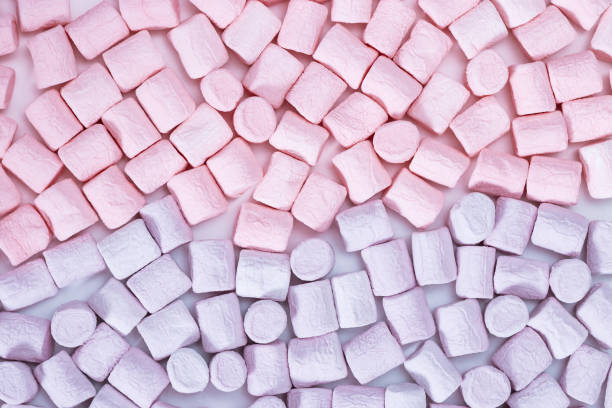 istock Sweet Marshmallow Pattern. Sweets close up. Pink and lilac mini zephyr. Food background. Gift card. Top view. 1148121794