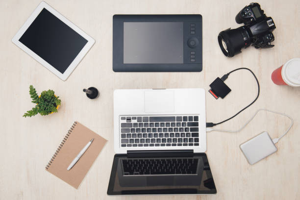 istock Top view laptop and camera workspace of photographer. 1148129131