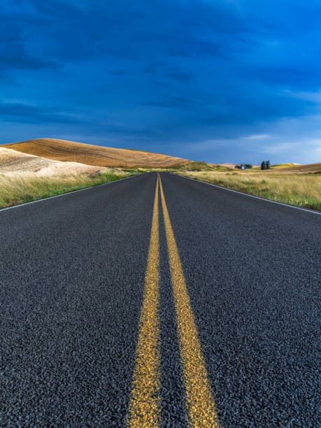 istock USA,Washington State,Palouse hills,road between fields 1148129258