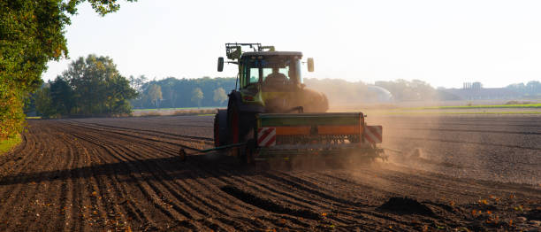 istock Field work with the tractor on the field 1148136820